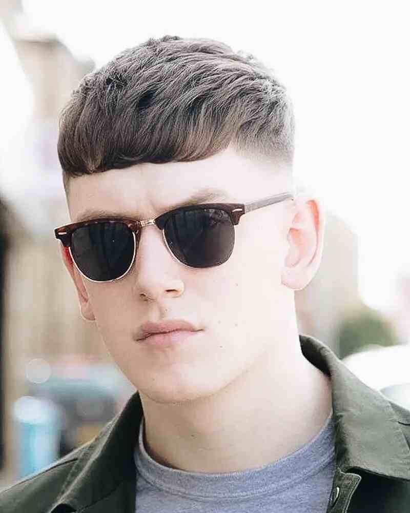 Short-Hairstyles-For-Men-Fade-With-Long-Bangs​